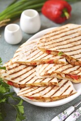 Mexican tortilla with chicken fillet,  bell peppers, onions and beans in tomato sauce.