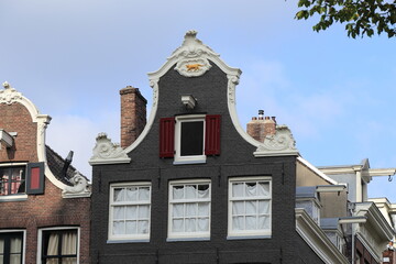 Amsterdam Leliegracht Canal Historic House with Bell Gable and Gable Stone with Yellow Cat Close Up, Netherlands