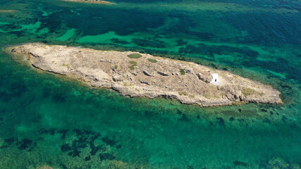 Aerial drone photo of small islet and chapel of Agios Ermolaos, Skyros island, Sporades, Greece
