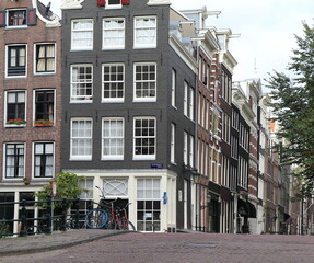 Fototapeta na wymiar Amsterdam Canal Street View with House Facades, Netherlands