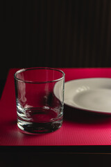 plate and tumbler in dark environment