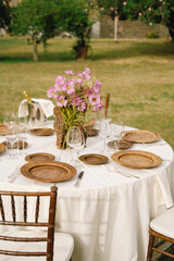 For a set wedding table in nature in seasoned light colors