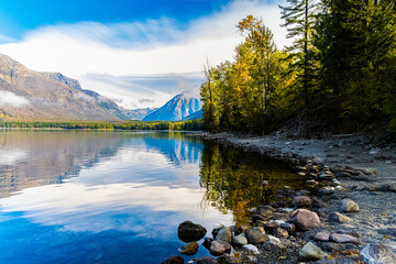 Mountains Reflected on The Still Waters of Lake McDonald, Glacier National Park, Montana, USA