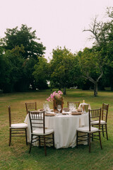 For a set wedding table in nature in seasoned light colors