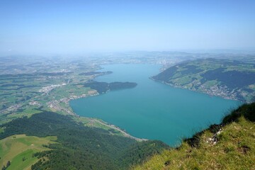 Fototapeta na wymiar Lake Zug in Switzerland in summer. High angle view from the top of mountain called Rigi Kulm. 