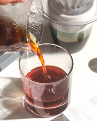 Pouring tea or coffee into cup
