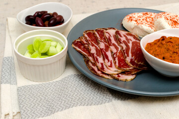 Plate with Bulgarian salami - babek, cheese and chutney