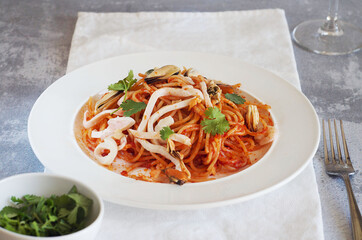 Pasta with seafood: squid and mussels. Italian food.