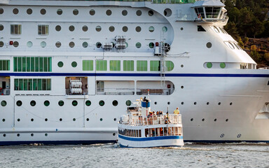 Local ferry waiting for big Cruise liner to pass, Sweden, Stockholm