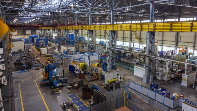 Worker with melt metal in steelmaking workshop and modern air compressors assembling shop at production plant timelapse