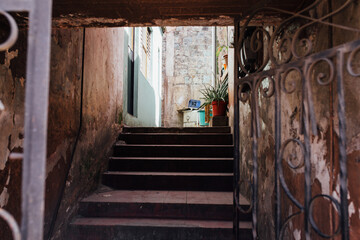 A gate to stairs to homes in Oaxaca.