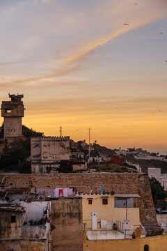 Quiet calm town with houses and brick walls at sunset