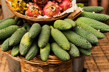 Ananas banana fruit Monstera deliciosa at Mercado Dos Lavradores.