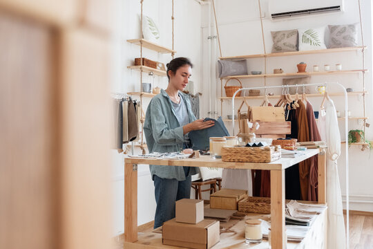 Female arranging ecological goods on table