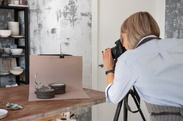 Craftswoman taking photos for portfolio