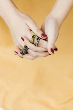 Studio shoot of female hands wearing handmade rings