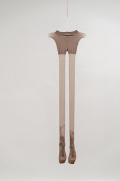 Hanging thin pantyhose with ballet shoes inside