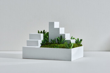 miniature white stair on the green grass,