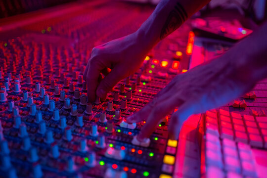 Two Hands On The Soundboard In The Sound Studio.