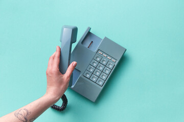 Woman holding vintage telephone handset