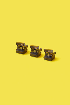 Three retro instant cameras