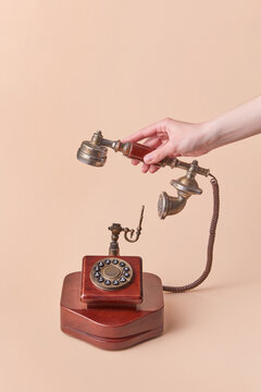 Woman holding old telephone handset