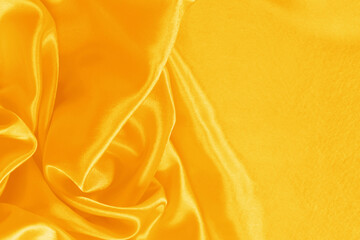 Obraz premium Elegant bright satin with waves. Fabric backdrop, view from above. Luxury cloth texture. Prefect as an abstract background with copy space, close-up.