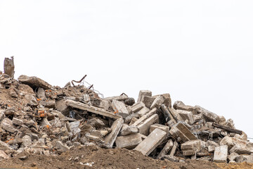 Building debris isolated on a white background. Pieces of concrete walls, steel reinforcement,...