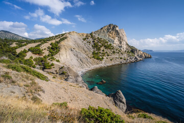 Summer Crimean landscape. Golitsyn trail at rocky Black Sea coast at sunny day, Novyi Svit, Sudak Municipality, Crimea - obrazy, fototapety, plakaty