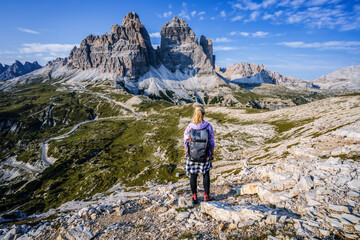 Woman hiker exploring Tre Cime di Lavaredo national park. Trentino-Alto-Adige, Dolomiti, Italy