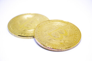 Bitcoin isolated on white background. Bitcoin golden coin isolated. Selective focus on bitcoin.   Bitcoin charts concept. Stock market concept. Crypto currency concept. Crypto coin sign and symbol.
