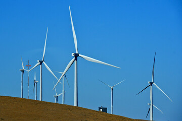 Placement of large wind turbines is critical to maximize wind exposure on wind farms, Altamont...