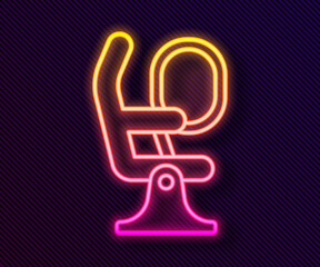 Glowing neon line Airplane seat icon isolated on black background. Vector