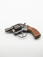 A metal pistol. A child's toy for playing war..