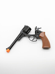 A metal pistol. A child's toy for playing war..