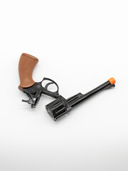 A metal pistol. A child's toy for playing war..