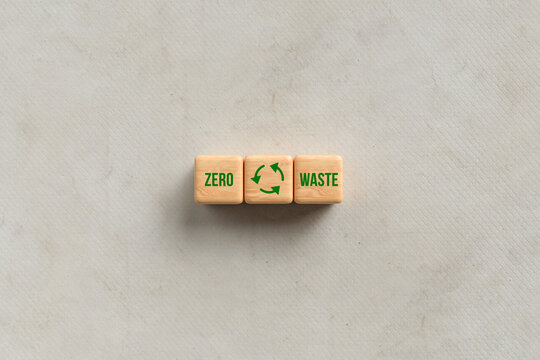 cubes with message ZERO WASTE on paper background