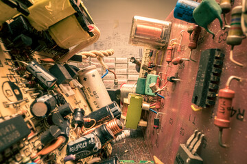 Retro electronics workshop. with parts, soldering iron and voltmeter