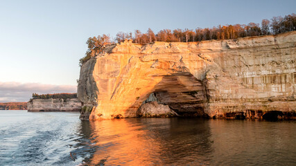 Fototapeta na wymiar Pictured Rocks along the shore of Lake Superior on autumn under sunset
