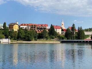 Obraz premium The picturesque mountain village of Fuzine above the artificial accumulation lake Bajer - Gorski kotar, Croatia (Slikovito goransko naselje Fužine nad umjetnim akumulacijskim jezerom Bajer - Hrvatska)