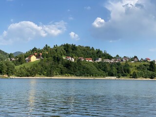 The picturesque mountain village of Fuzine above the artificial accumulation lake Bajer - Gorski kotar, Croatia (Slikovito goransko naselje Fužine nad umjetnim akumulacijskim jezerom Bajer - Hrvatska)