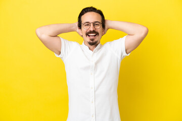 Fototapeta na wymiar Young caucasian man isolated on yellow background laughing