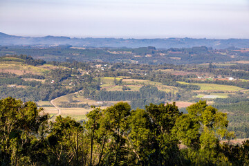 Fototapeta na wymiar Valley with farm fields and forest