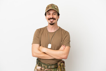 Soldier man isolated on white background keeping the arms crossed in frontal position