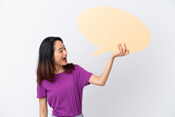 Young Vietnamese woman isolated on white background holding an empty speech bubble