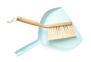 Light blue dustpan and wooden brush on white background, top view