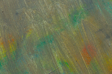 abstract faded multicolored background resulting from washing off paints from canvas, short focus. Not an art object, temporary effect.