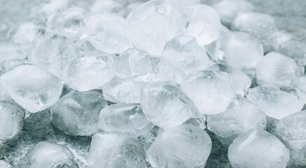 Many ice cubes on a metal background