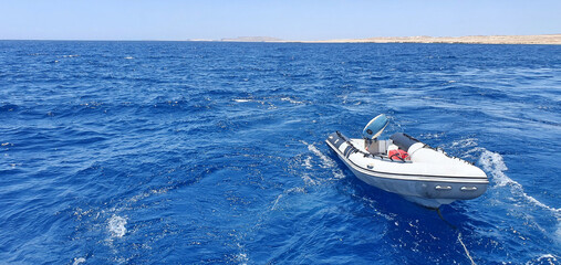Motor boat on the high seas. Beautiful sea in Egypt. Sea view.