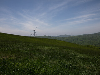 Blue sky and wind power generators.
